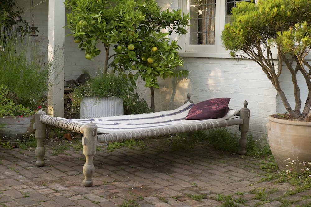 Two adults relaxing in deckchairs at an event at Borde Hill during the summer.